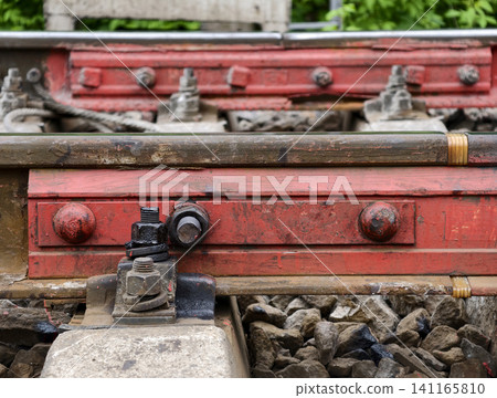 Rail joint polymer pad prevents electrical contact while absorbing dynamic loads from train movement 141165810