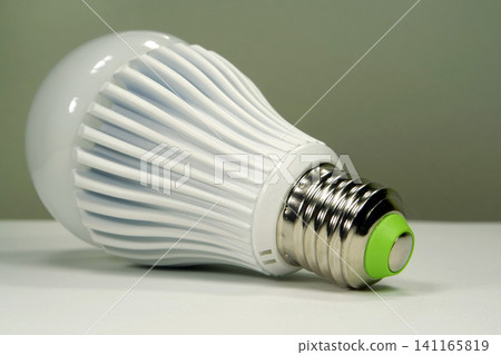 Large white LED bulb with E27 base isolated on neutral background Large white LED bulb with E27 base isolated on neutral background 141165819