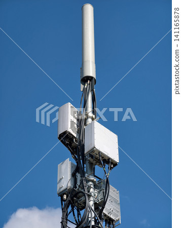 5G infrastructure tower placed in an urban setting providing fast internet 5G infrastructure tower placed in an urban setting providing fast internet 141165878