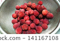 Washed bayberries in a colander 141167108