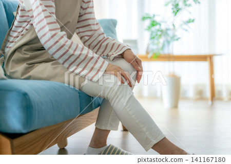 A woman complaining of knee pain A woman complaining of knee pain 141167180