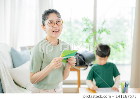 Family, living room, mom, bankbook Family, living room, mom, bankbook 141167575
