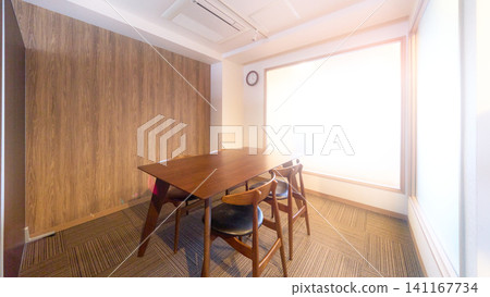 A private meeting room bathed in bright light. 141167734