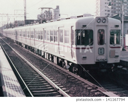 A close-up of the front of a Keio 5000 series (5100 series) train stopped at a station. A close-up of the front of a Keio 5000 series (5100 series) train stopped at a station. 141167794