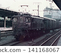 A freight train pulled by an EF13 electric locomotive (No. 11) stopped in a station yard during the Japanese National Railways era. 141168067