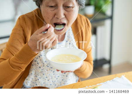 Senior women eating specially prepared meals Senior women eating specially prepared meals 141168469