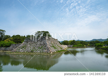 Yamaguchi Prefecture / "Sites of Japan's Meiji Industrial Revolution: Iron and Steel, Shipbuilding, and Coal Mining" Hagi Castle under a blue sky and surrounded by fresh greenery (Hagi Castle Ruins) Yamaguchi Prefecture / "Sites of Japan's Meiji Industrial Revolution: Iron and Steel, Shipbuilding, and Coal Mining" Hagi Castle under a blue sky and surrounded by fresh greenery (Hagi Castle Ruins) 141169110