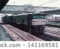 A freight train pulled by an EF58 electric locomotive (No. 152) stopped at Omiya Station during the Japanese National Railways era. 141169581