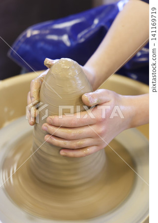 Pottery using a potter's wheel Pottery using a potter's wheel 141169719