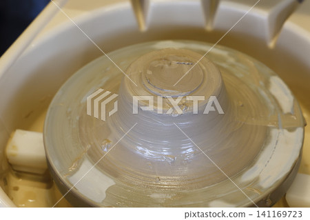 Pottery using a potter's wheel Pottery using a potter's wheel 141169723