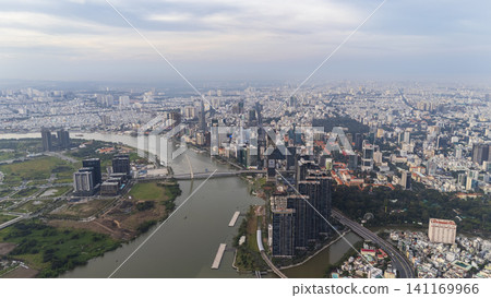 Drone aerial panoramic view of the Saigon River, Ba Son Bridge, and the modern city skyline of District 1 in Ho Chi Minh City, Vietnam. Drone aerial panoramic view of the Saigon River, Ba Son Bridge, and the modern city skyline of District 1 in Ho Chi Minh City, Vietnam. 141169966