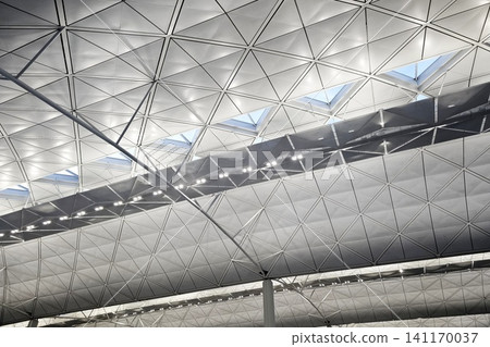 Triangulated geometric roof structure and ceiling interior of Hong Kong International Airport. Triangulated geometric roof structure and ceiling interior of Hong Kong International Airport. 141170037