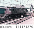 An EF15 electric locomotive (No. 196) parked alone in the premises of Omiya Station during the Japanese National Railways era. 141171270