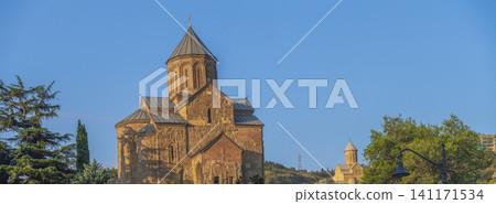 Ancient Metekhi church in old Tbilisi at golden hour with clean sky copy space Ancient Metekhi church in old Tbilisi at golden hour with clean sky copy space 141171534