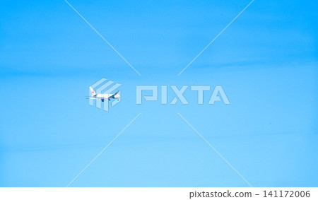 A scene of an airplane taking off into the blue sky. A scene of an airplane taking off into the blue sky. 141172006