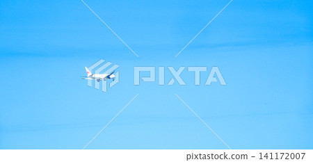 A scene of an airplane taking off into the blue sky. A scene of an airplane taking off into the blue sky. 141172007