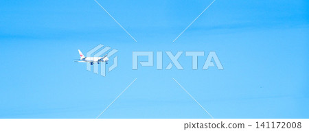 A scene of an airplane taking off into the blue sky. A scene of an airplane taking off into the blue sky. 141172008