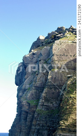 The towering cliffs and blue sky of Yonaguni Island in Okinawa Prefecture The towering cliffs and blue sky of Yonaguni Island in Okinawa Prefecture 141172190