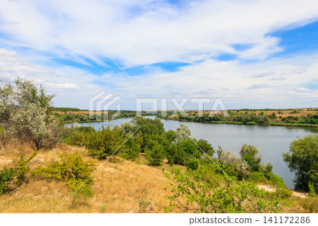 Summer landscape with beautiful river, green trees and blue sky Summer landscape with beautiful river, green trees and blue sky 141172286