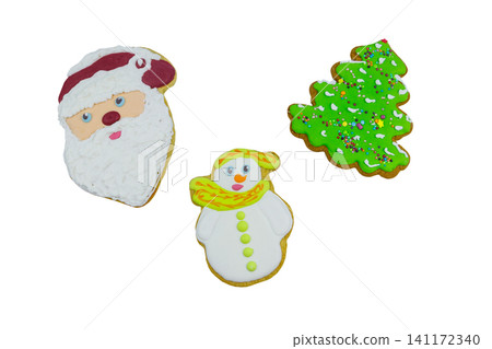 Christmas gingerbread cookie made in shape of Christmas tree isolated on white background Christmas gingerbread cookie made in shape of Christmas tree isolated on white background 141172340