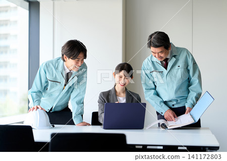 Asian construction professionals having a meeting Asian construction professionals having a meeting 141172803