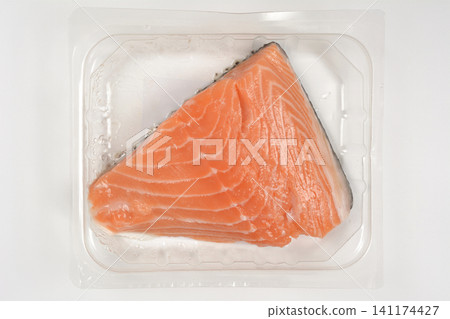 Raw Salmon Fillet in Plastic Packaging Container Raw Salmon Fillet in Plastic Packaging Container 141174427