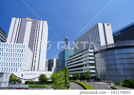 The modern office buildings of Yokohama's Minato Mirai Shin-Takashima area stand tall against a clear blue sky. The modern office buildings of Yokohama's Minato Mirai Shin-Takashima area stand tall against a clear blue sky. 141174601