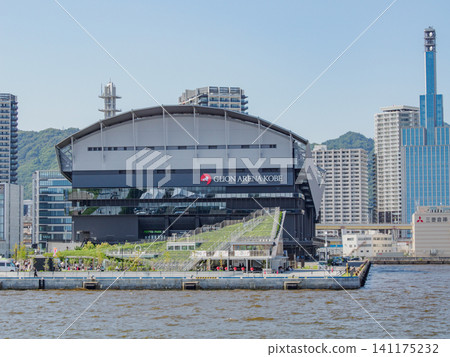 G-Lion Arena Kobe in Meriken Park and the Kobe city skyline as seen from a sightseeing boat in Kobe Port. G-Lion Arena Kobe in Meriken Park and the Kobe city skyline as seen from a sightseeing boat in Kobe Port. 141175232