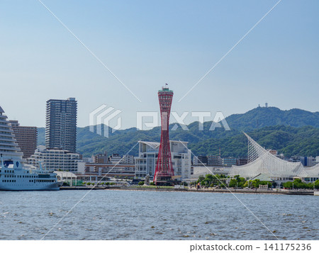 Port Tower and Mount Rokko as seen from a sightseeing boat in Kobe Port. 141175236