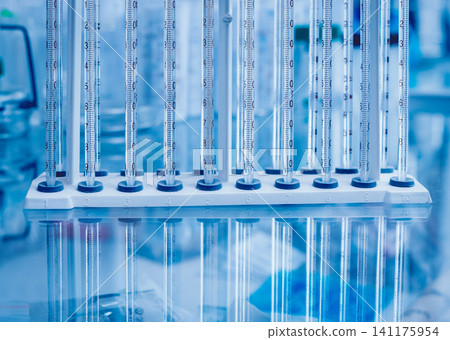 Test tube on blue background. Test tube on blue background. 141175954