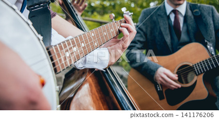 Trio of musicians with a guitar, banjo and contrabass Trio of musicians with a guitar, banjo and contrabass 141176206