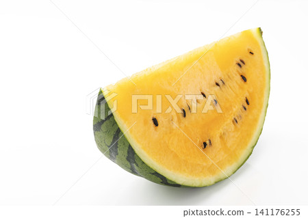 A sliced yellow watermelon against a white background. A sliced yellow watermelon against a white background. 141176255