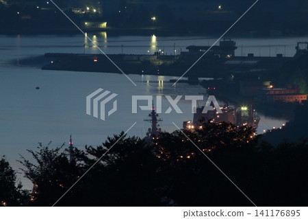 A ship floating on the sea at dawn A ship floating on the sea at dawn 141176895