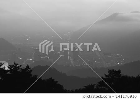 A city covered in clouds A city covered in clouds 141176916