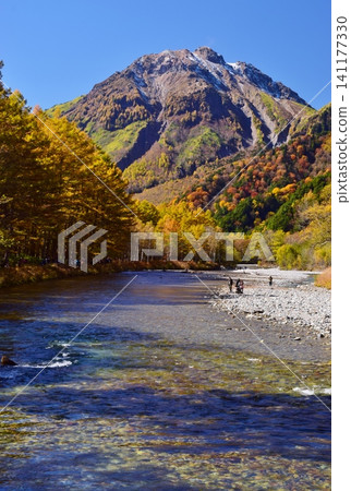 Autumn view of Mt. Yake from Kamikochi amidst the fall foliage. Autumn view of Mt. Yake from Kamikochi amidst the fall foliage. 141177330