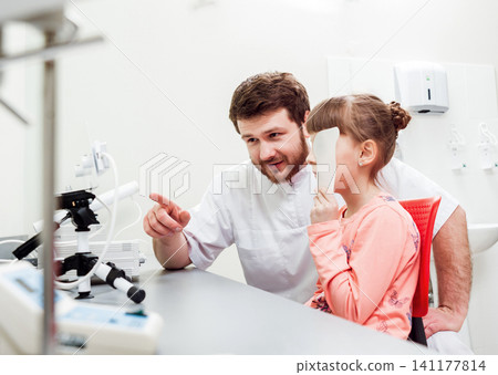 Orthoptics. Pleoptics. Doctor explains how to use ophthalmic equipment. Eye training. Vision rehabilitation. Orthoptics. Pleoptics. Doctor explains how to use ophthalmic equipment. Eye training. Vision rehabilitation. 141177814