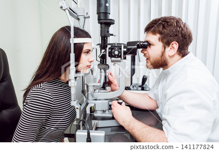 Slit lamp examination. Biomicroscopy of the anterior eye segment. Basic eye examination. Slit lamp examination. Biomicroscopy of the anterior eye segment. Basic eye examination. 141177824