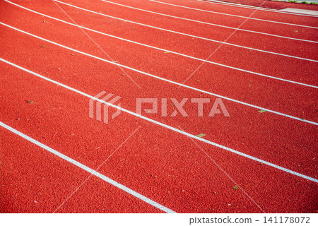 Athletics stadium running track red lines marks. Athletics stadium running track red lines marks. 141178072
