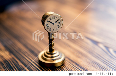 Little vintage clocks on the table. 141178114