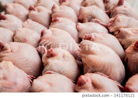 Fresh chicken bodies in a basket Fresh chicken bodies in a basket 141178121