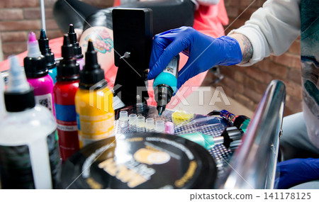 Professional tattooist Professional tattooist 141178125