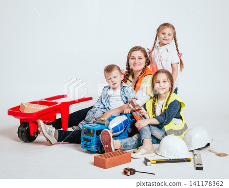 Happy family in new house. Construction, repair, interior. Happy family in new house. Construction, repair, interior. 141178362