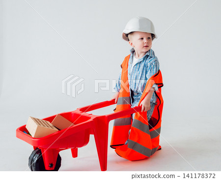 Little boy on the white background. Construction Little boy on the white background. Construction 141178372