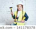 Little girl on the white background. Construction 141178378