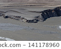 Due to a lack of rain during the winter, parts of the lakebed of the dam lake are beginning to become visible in spring. 141178960