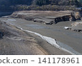Due to a lack of rain during the winter, parts of the lakebed of the dam lake are beginning to become visible in spring. 141178961