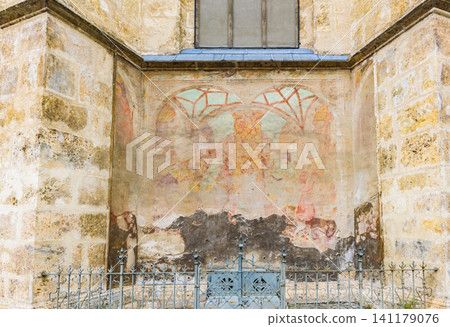 Historical medieval Gothic frescoes remaining on the exterior walls of Graz Cathedral Historical medieval Gothic frescoes remaining on the exterior walls of Graz Cathedral 141179076