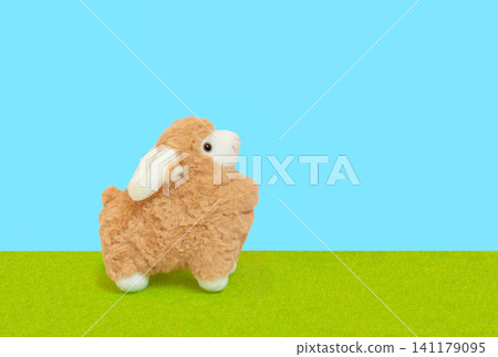 Sheep plush toy, background material for New Year's cards for the Year of the Sheep - Blue sky image Sheep plush toy, background material for New Year's cards for the Year of the Sheep - Blue sky image 141179095