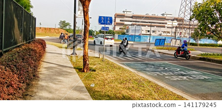 City street scene with a bike lane 141179245
