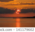 Sunset over the sea 141179602